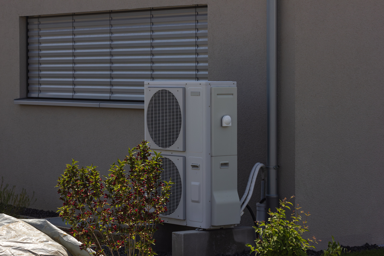 heat pump in a new building area with modern house facades heat pump in a new building area with modern house facades